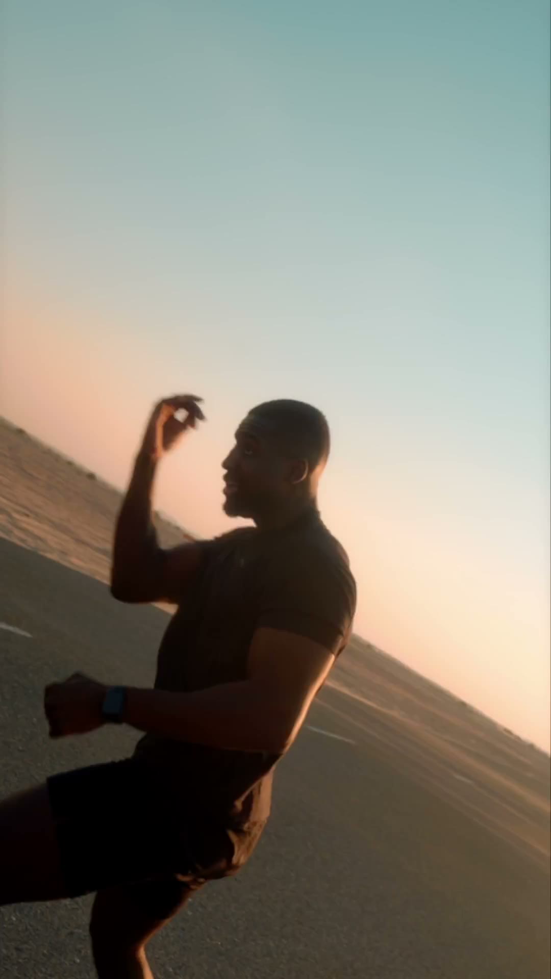 A drink held up against a clear sky