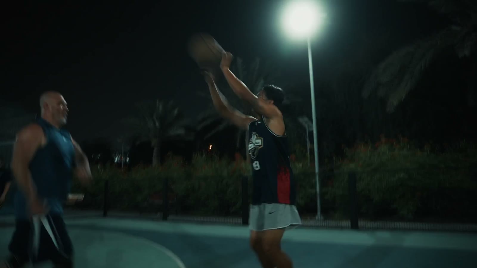 Floodlit basketball court at night in Dubai